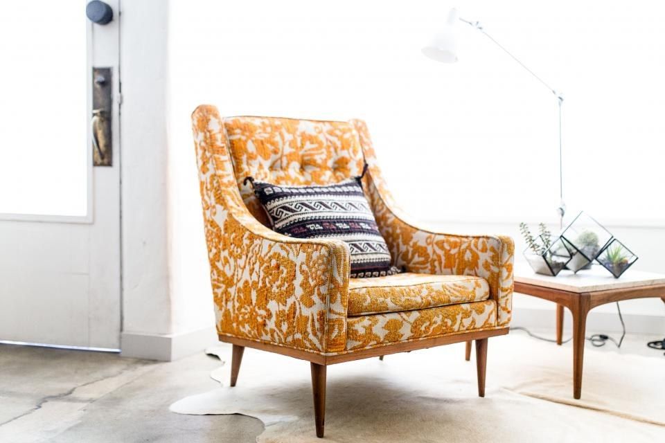 Bright hall with an armchair and a side table